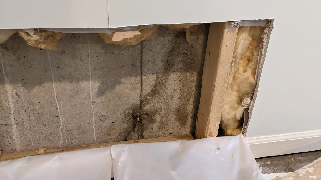 Water damage on basement wall before repair